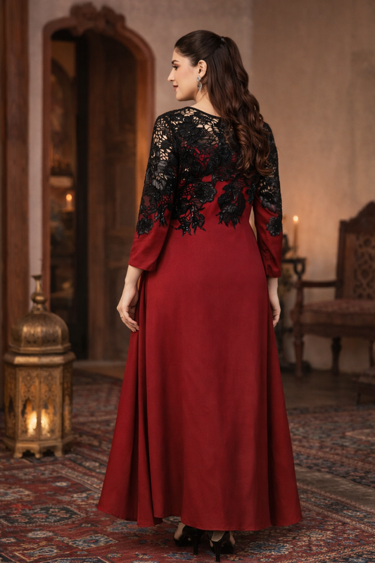 Woman wearing a red dress with black lace sleeves in an ornate room.