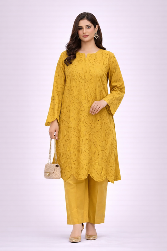 Woman wearing a yellow kurta with pants on a white background